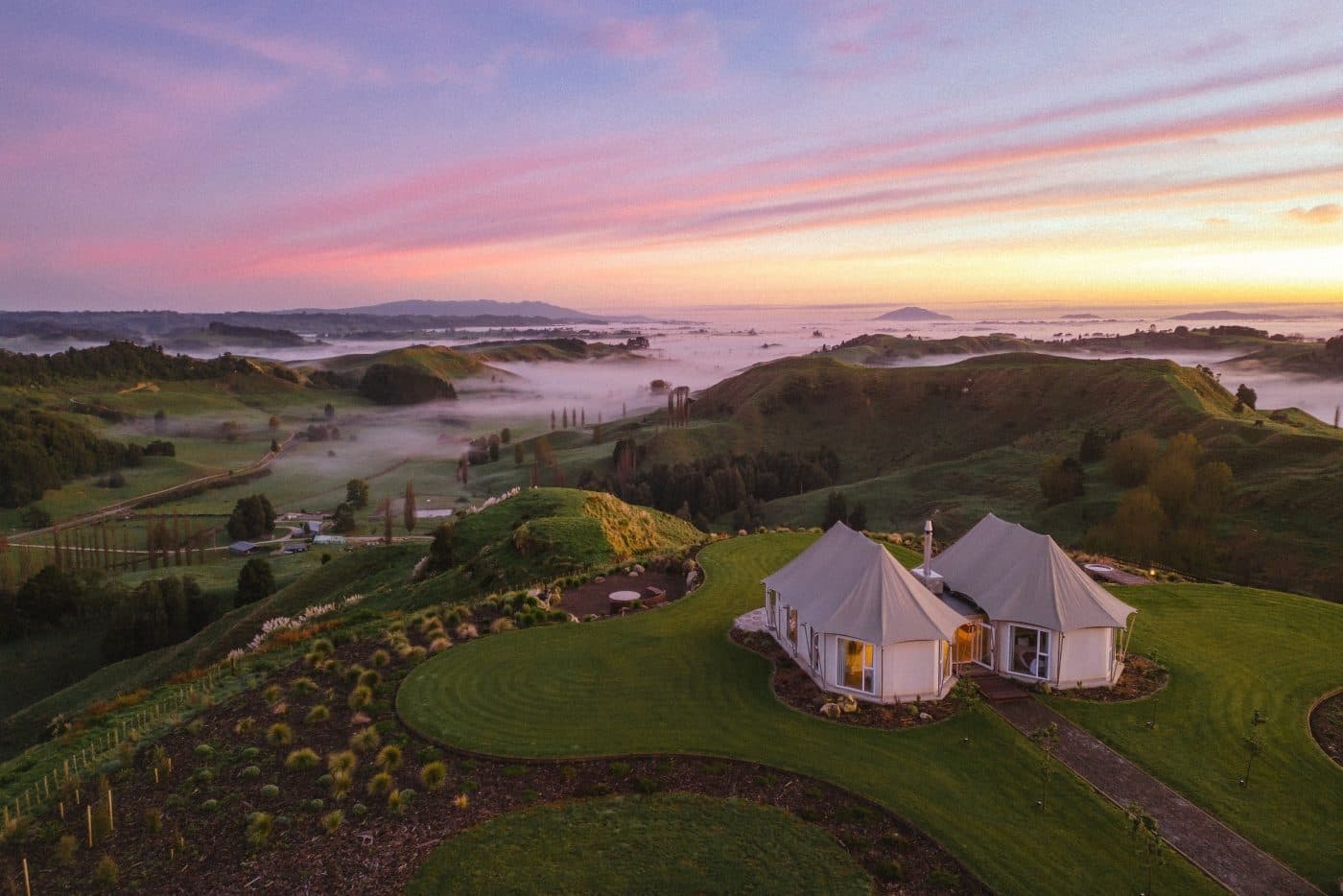 Wild Canvas tents on a Waikato hilltop at sunrise