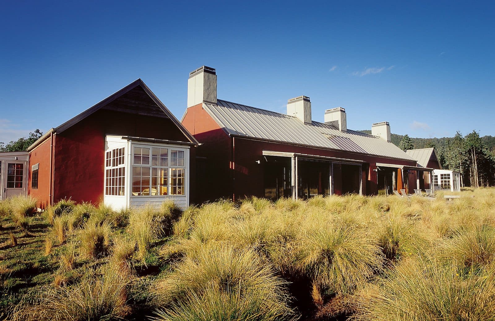 Poronui’s lodge buildings on tussock country in the mountains above Taupō